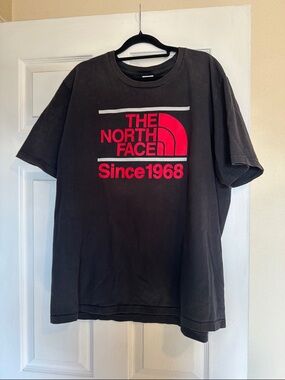The North Face Black Tee with Red Logo and Accent Stripes